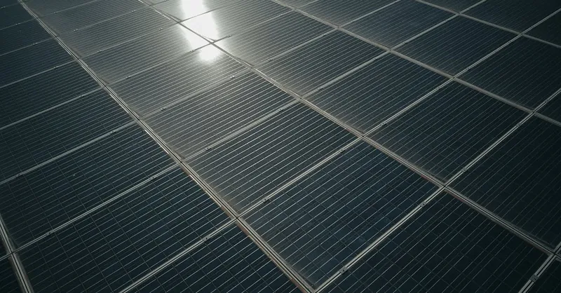 Captivating close-up of solar panels reflecting sunlight, showcasing renewable energy technology.