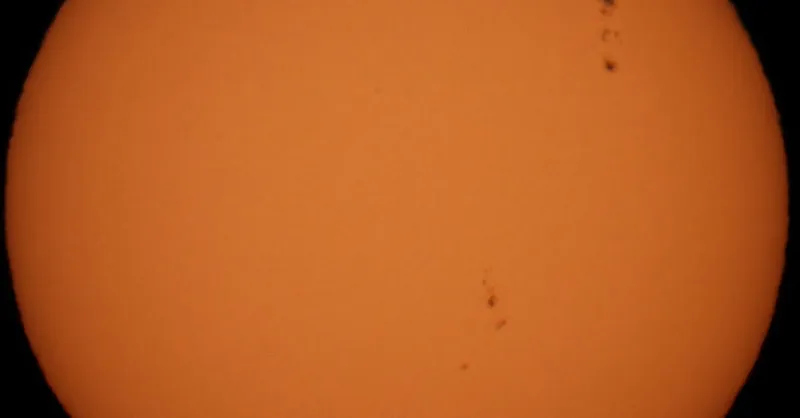 Detailed photo of the Sun showing sunspots, ideal for science or astronomy content.