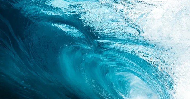 Vibrant blue ocean wave in motion, showcasing the beauty and power of nature