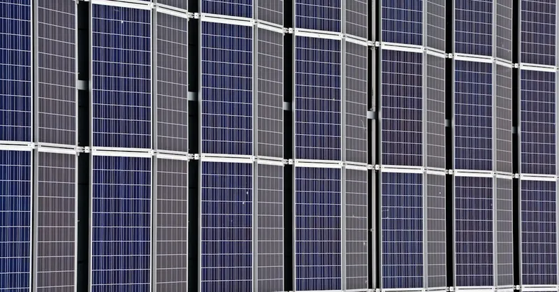 Close-up of multiple solar panels representing renewable energy and sustainability.